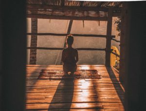 woman meditating, photo by Jared Rice