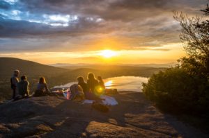 people looking over valley, photo by Arthur Poulin